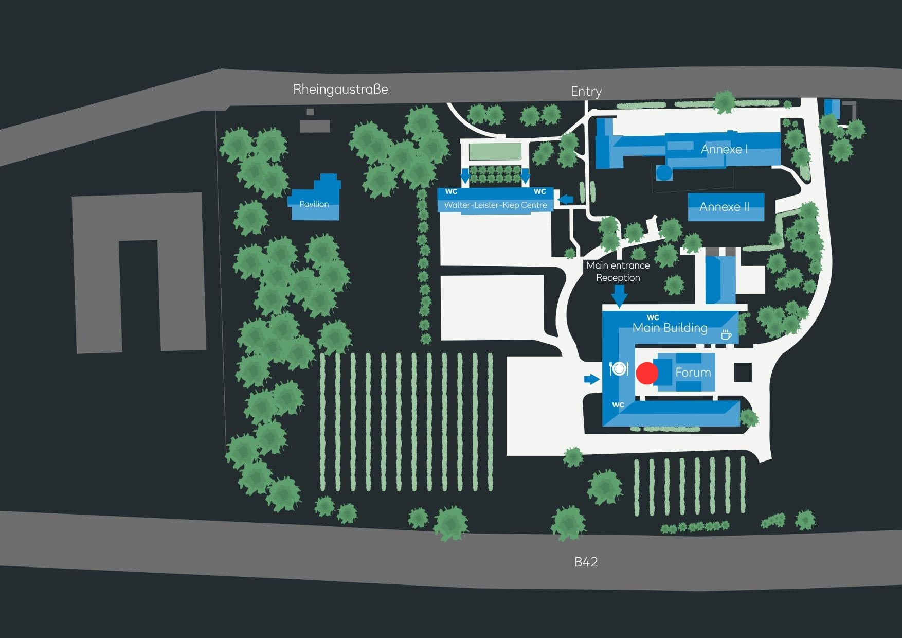 Site plan of an area featuring various buildings, including the main building, the forum, and the reception area. Surrounded by green spaces, trees, and vineyards, with access from Rheingastraße and B42.