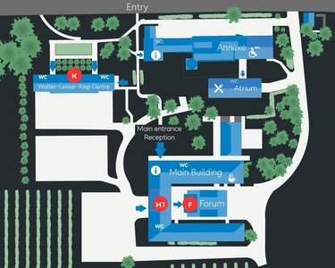 Site plan of an area with various buildings, including the main building, a reception area, and a forum. Surrounded by gardens and vineyards, with marked entrances and pathways.