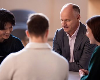Professor talks to students at EBS University